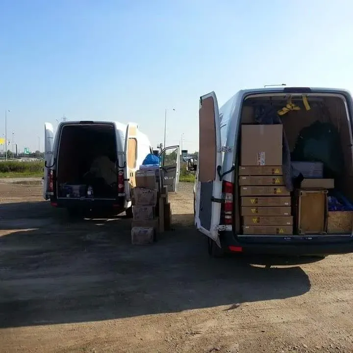 Europa Xpress courier vans loading in Italy for the UK