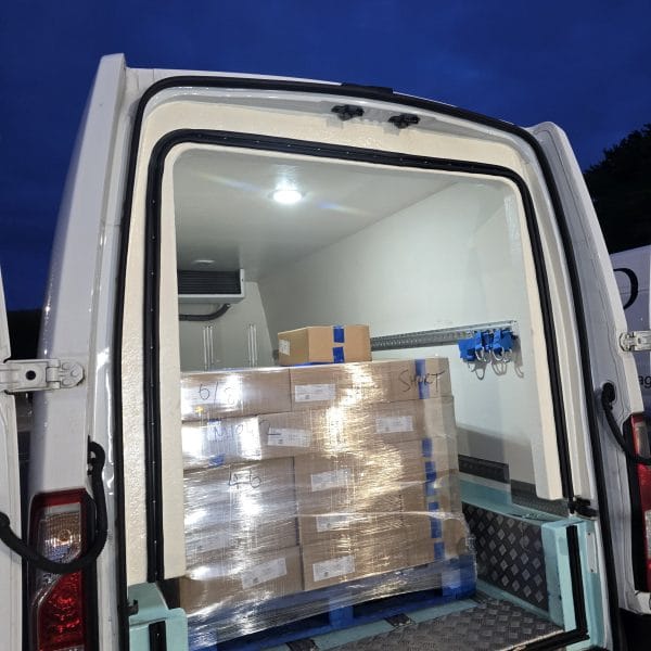 Refrigerated van interior transporting chilled food products under temperature-control