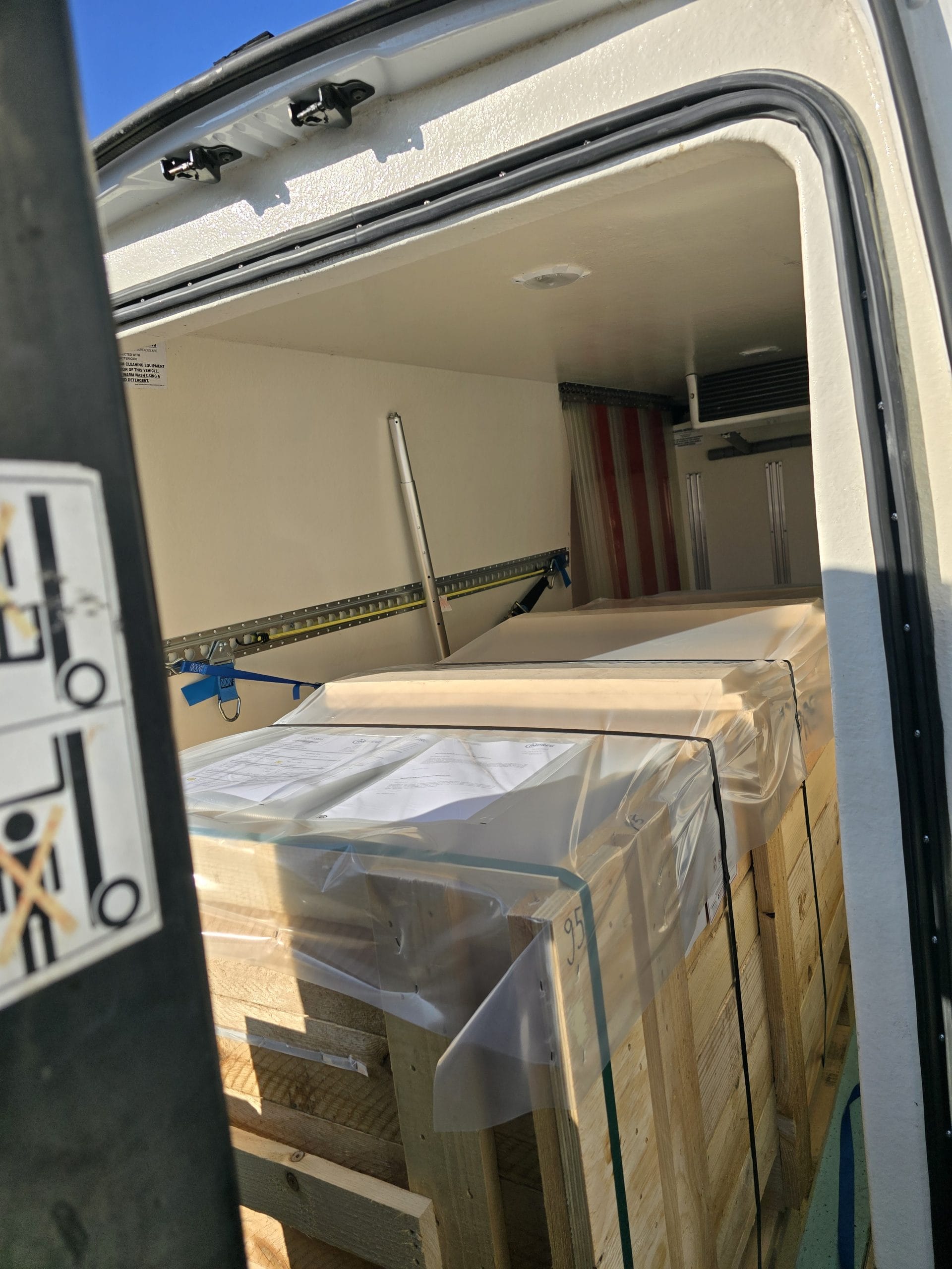 Europa Xpress refrigerated courier vehicle loading temperature-controlled commercial goods